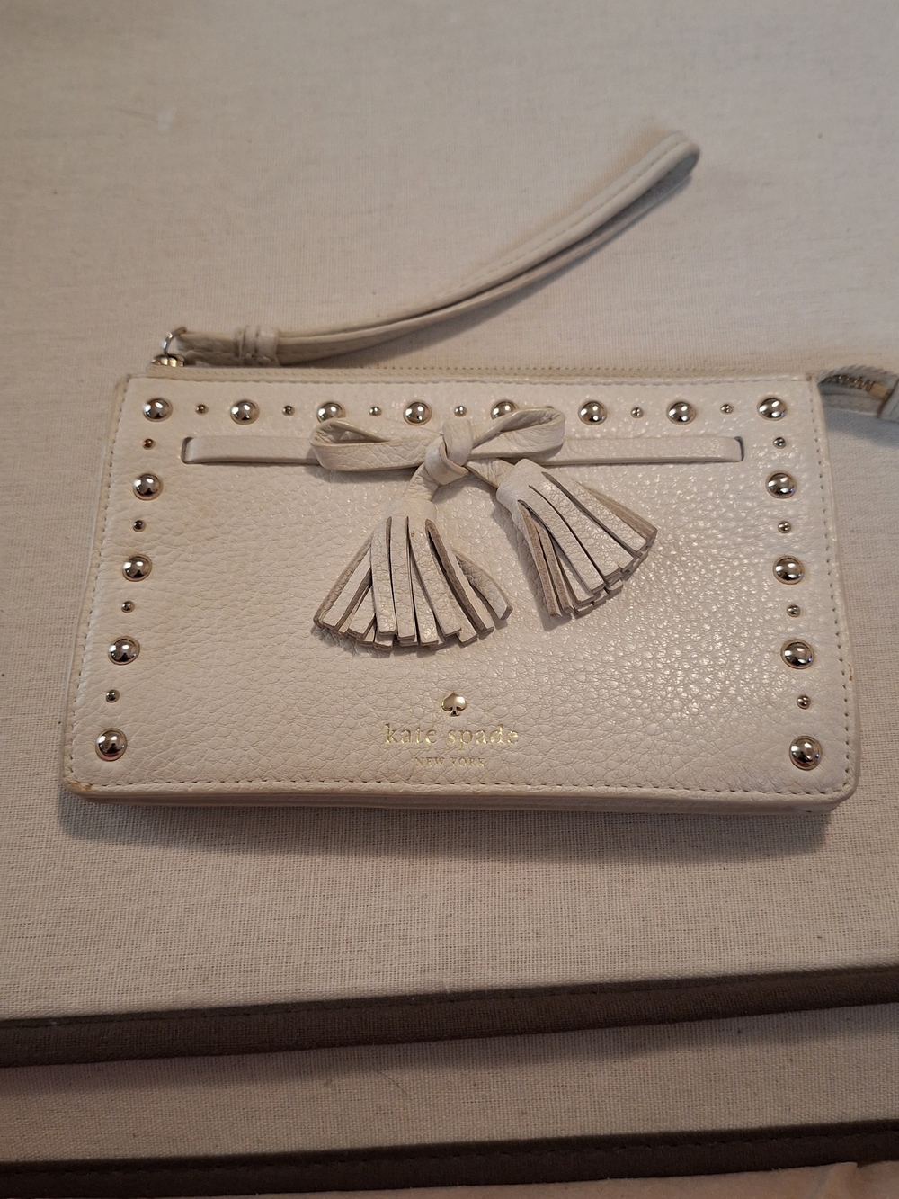 Kate Spade Cream Leather Tassel Wristlet